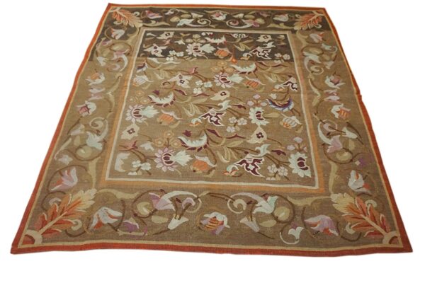A brown aubusson style rug with floral motifs in muted pastels, by rugs on net. By rugs on net