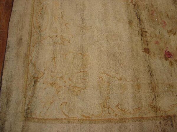 Faded floral antique carpet design.