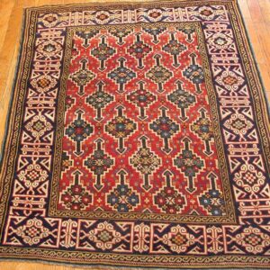 A vibrant red and navy geometric rug with repeating arrow motifs, by Rugs On Net. by Rugs On Net