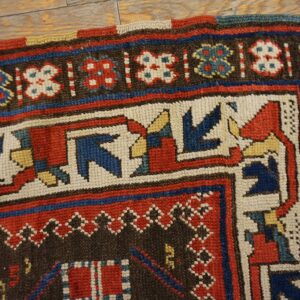 Close-up corner detail of a colorful tribal rug with geometric patterns by Rugs On Net