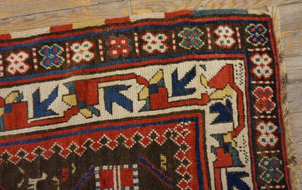 Close-up corner detail of a colorful tribal rug with geometric patterns by rugs on net