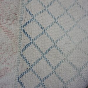 Textured fabric with geometric patterns.