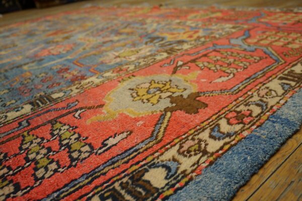 Close-up texture of a vibrant antique rug with red and blue tones, by rugs on net