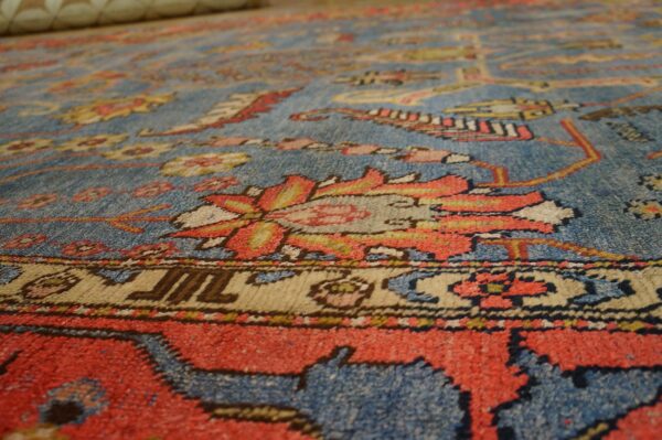 Close-up texture of a blue and red patterned rug by rugs on net
