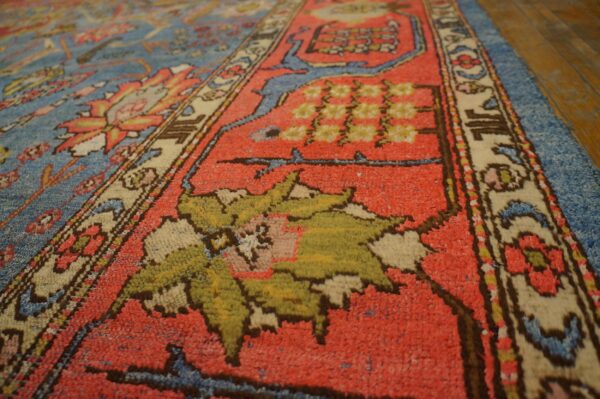 Close-up of a richly colored, traditional rug border with red, blue, and green motifs by rugs on net