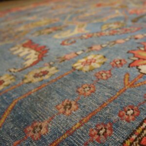 Close-up of a blue field rug with floral motifs by Rugs On Net. by Rugs On Net