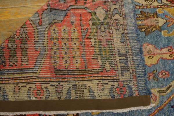 Close-up showing the weave and colors of the vintage blue rug by rugs on net. By rugs on net