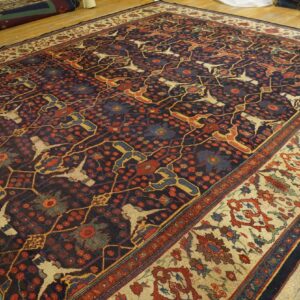 Dark field rug with stylized birds and floral motifs, by Rugs On Net