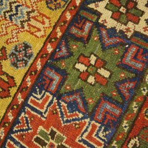 Close-up of colorful geometric patterns on a tribal rug by Rugs On Net. by Rugs On Net