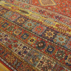 Close-up of a vibrant, striped antique rug with geometric patterns by Rugs On Net