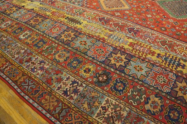 Close-up of a vibrant, striped antique rug with geometric patterns by rugs on net