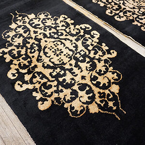Black rugs with ornate gold patterns