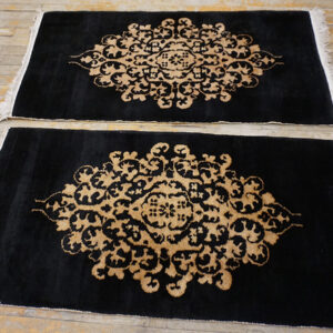 Black rug on wooden floor