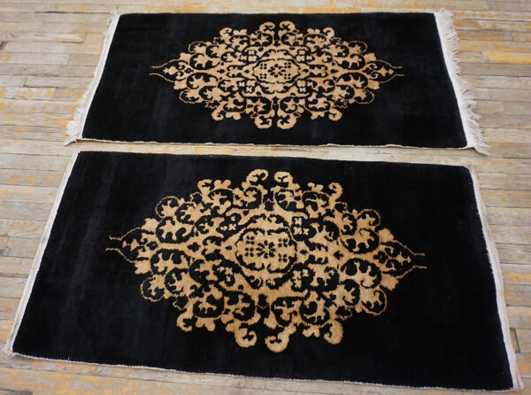 Black rug on wooden floor