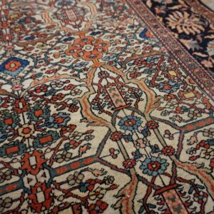 Close-up of the intricate floral pattern on the light-colored field of the Persian rug by Rugs On Net. by Rugs On Net