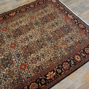 Close-up view of a cream field rug with intricate floral patterns in red and blue, bordered in black, by Rugs On Net