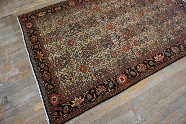 An overhead view of an intricately patterned persian rug with cream, red, and blue accents on a distressed wooden floor by rugs on net. By rugs on net