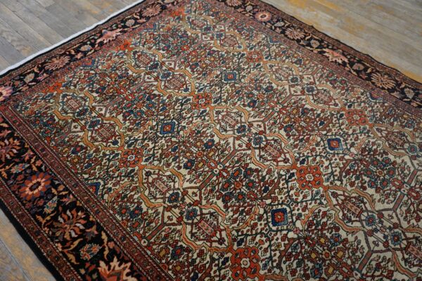 Close-up view of a traditional floral patterned rug with cream, orange, and blue accents by rugs on net