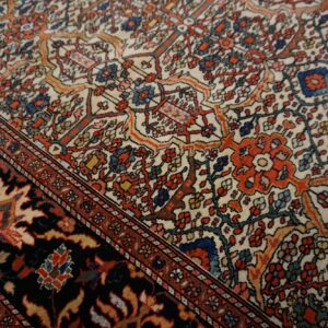 Close-up of a detailed floral pattern on a Persian rug by Rugs On Net. by Rugs On Net