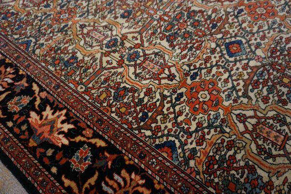 Close-up of a detailed floral pattern on a persian rug by rugs on net. By rugs on net