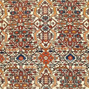 Close-up of a traditional rug pattern featuring intricate floral and geometric motifs in red, blue, and earth tones on a cream background, by Rugs On Net. by Rugs On Net