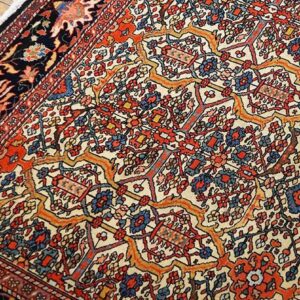 Close-up of a vibrant Tree of Life pattern on a Persian rug by Rugs On Net