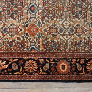 Close-up of the intricate floral patterns and dark border on the Persian rug by Rugs On Net. by Rugs On Net