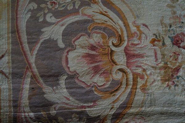Faded floral pattern on textured fabric