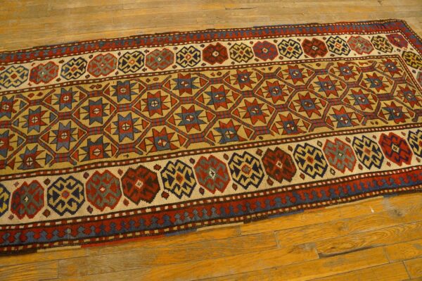 Close-up of a colorful geometric runner rug on a wooden floor by rugs on net