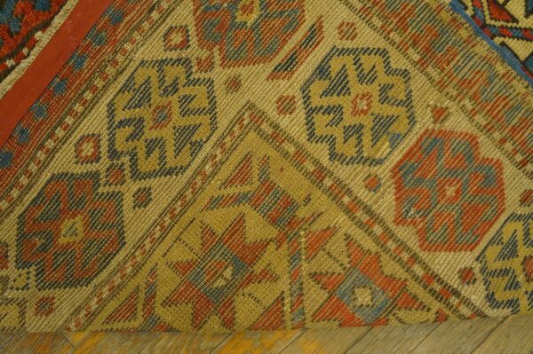 Close-up of the corner weave and geometric patterns of the antique kilim rug by rugs on net. By rugs on net