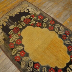 Close-up of a floral rug with red roses and a yellow center on a dark background by Rugs On Net