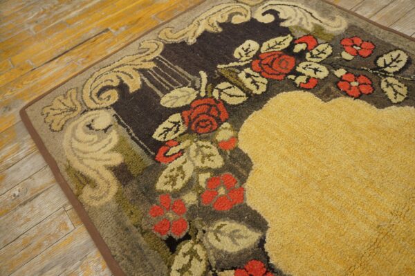 Close-up of a floral rug with red roses and gold accents on a dark background by rugs on net. By rugs on net