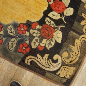 Close-up of a floral hooked rug corner with red roses and gold scrollwork by Rugs On Net