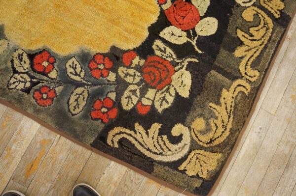 Close-up of a floral hooked rug corner with red roses and gold scrollwork by rugs on net