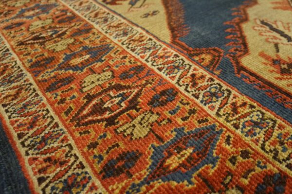 Close-up of the intricate geometric border pattern on the persian rug by rugs on net. By rugs on net