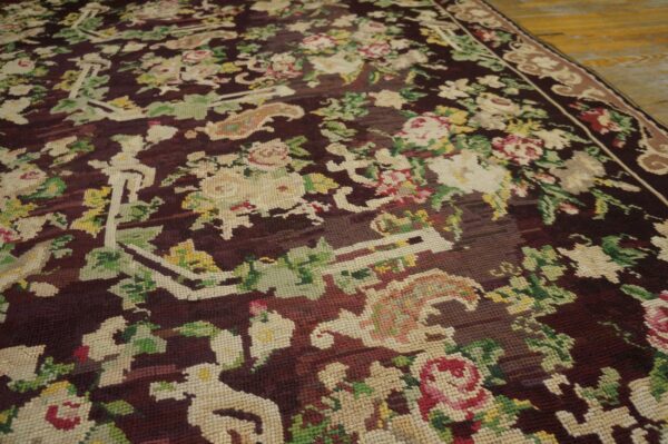Close-up of a dark aubergine rug with ivory and pink floral motifs, by rugs on net