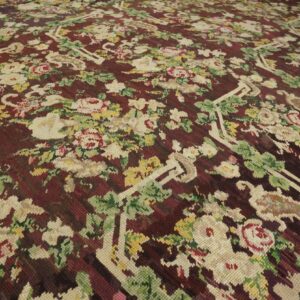Close-up of a floral Aubusson rug with cream and pink roses on a deep burgundy ground, by Rugs On Net. by Rugs On Net