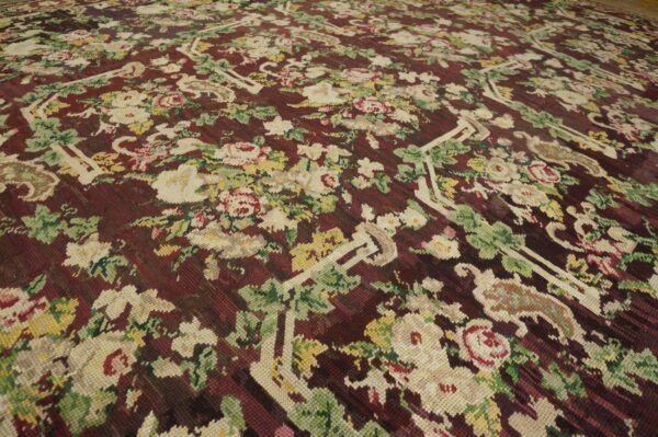 Close-up of a floral aubusson rug with cream and pink roses on a deep burgundy ground, by rugs on net. By rugs on net