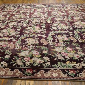 Large area rug with a dense, dark burgundy field covered in light-colored floral motifs and green foliage, design of the 'Aubusson Style Floral Rug' by Rugs On Net. by Rugs On Net