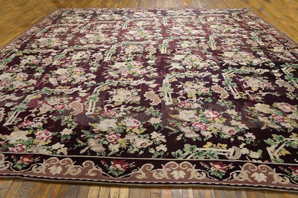 Large area rug with a dense, dark burgundy field covered in light-colored floral motifs and green foliage, design of the 'aubusson style floral rug' by rugs on net. By rugs on net