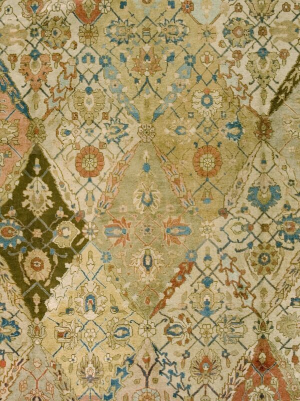Close-up of a vintage patchwork rug pattern with muted greens, blues, and terracotta accents by rugs on net
