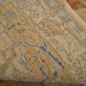 Close-up view of the backing and rolled edge of the Vintage Distressed Rug by Rugs On Net. by Rugs On Net