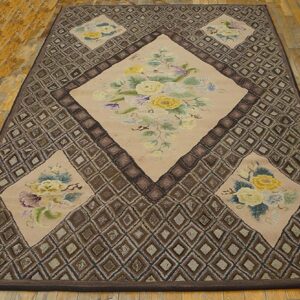 A rectangular rug featuring a central diamond medallion with yellow roses on a beige field, surrounded by a brown geometric border, by Rugs On Net. by Rugs On Net