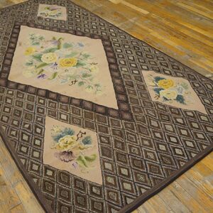 Rectangular rug featuring a geometric diamond border and central floral medallions in muted tones, by Rugs On Net