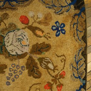 Close-up of a floral rug corner with tan ground and blue accents by Rugs On Net