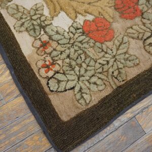 Close-up of the floral pattern corner of the Hooked Floral Rug by Rugs On Net. by Rugs On Net