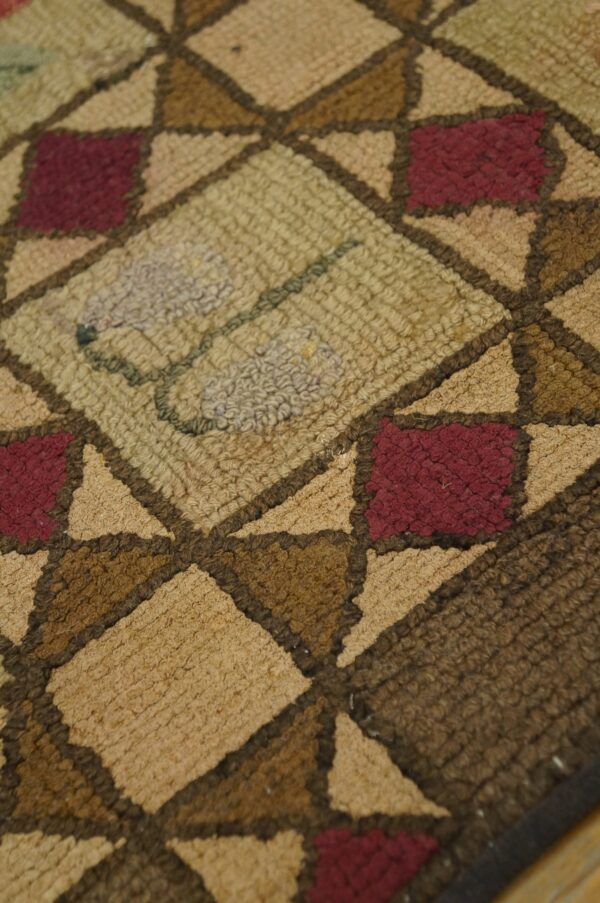 Close-up texture shot of a geometric pattern rug in earthy tones by rugs on net