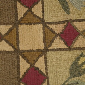Close-up of the geometric and floral pattern on the Hooked Wool Rug by Rugs On Net. by Rugs On Net