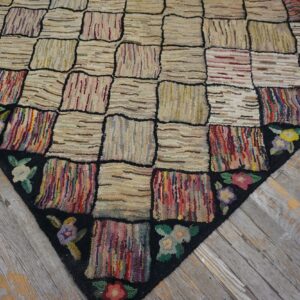 Close-up of a colorful checkerboard rag rug with floral border on wood floor by Rugs On Net