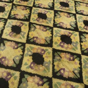 Close-up of a yellow and black floral checkered rug pattern by Rugs On Net
